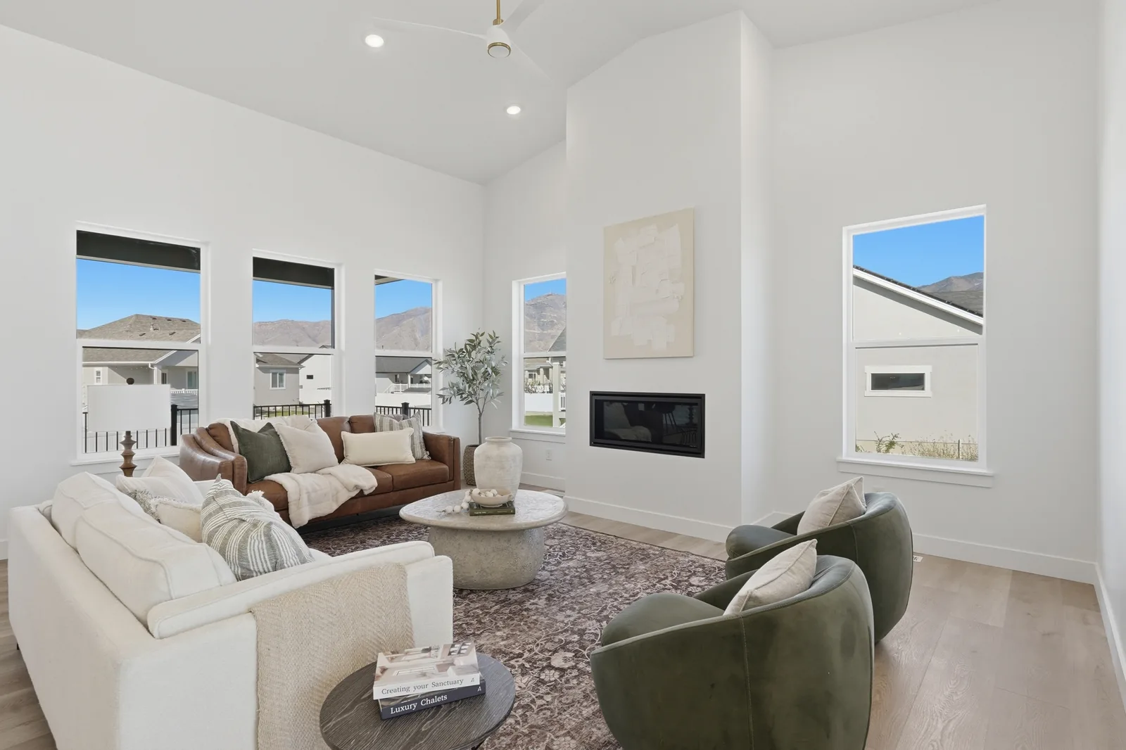 Chestnut Modern furnished living room with broad windows