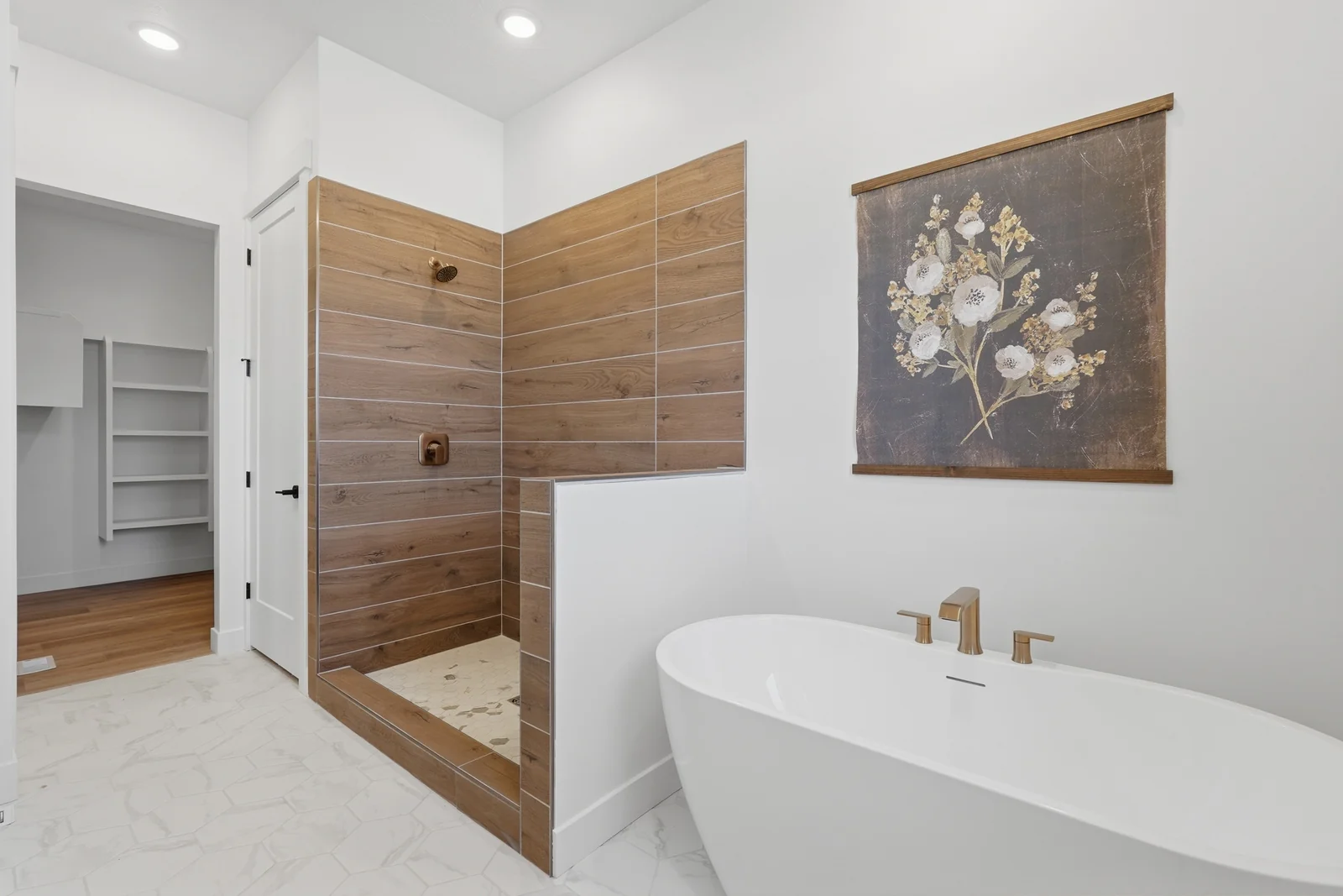 Bathroom featuring a freestanding tub, tiled shower, wood accent wall, and open shelving in Chestnut Modern MW302, Stansbury Park.