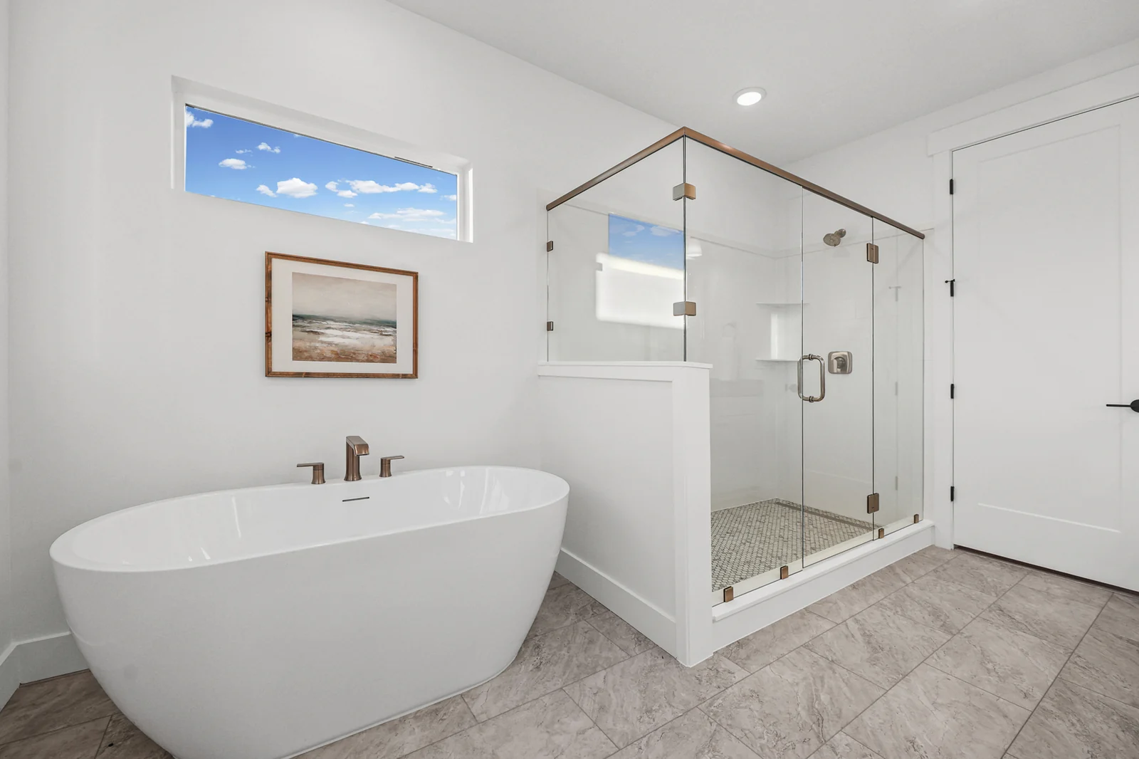 Bathroom view pairs a freestanding tub with a glass-enclosed shower, white walls, and tiled floor in Hawthorne Farmhouse, Ogden.