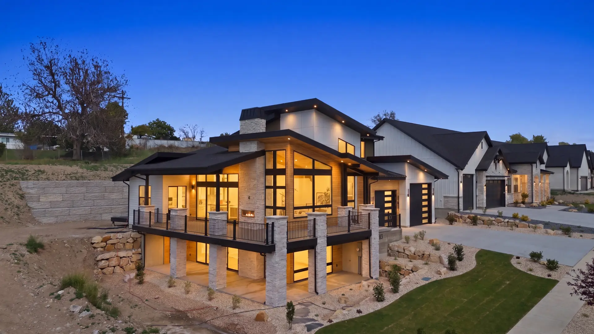 Modern Gold Crest home illuminated at dusk in Utah