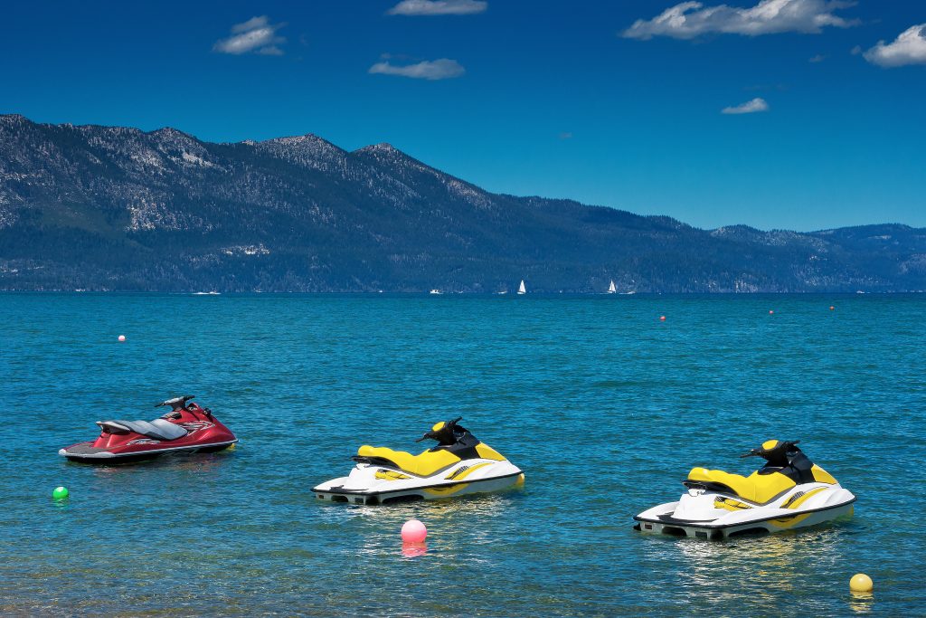 Bright colored hydrocycles stand on Lake Tahoe